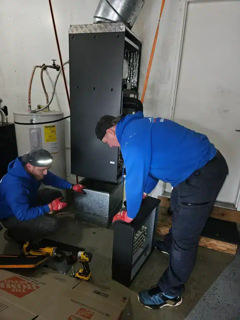 conrad workers with furnace